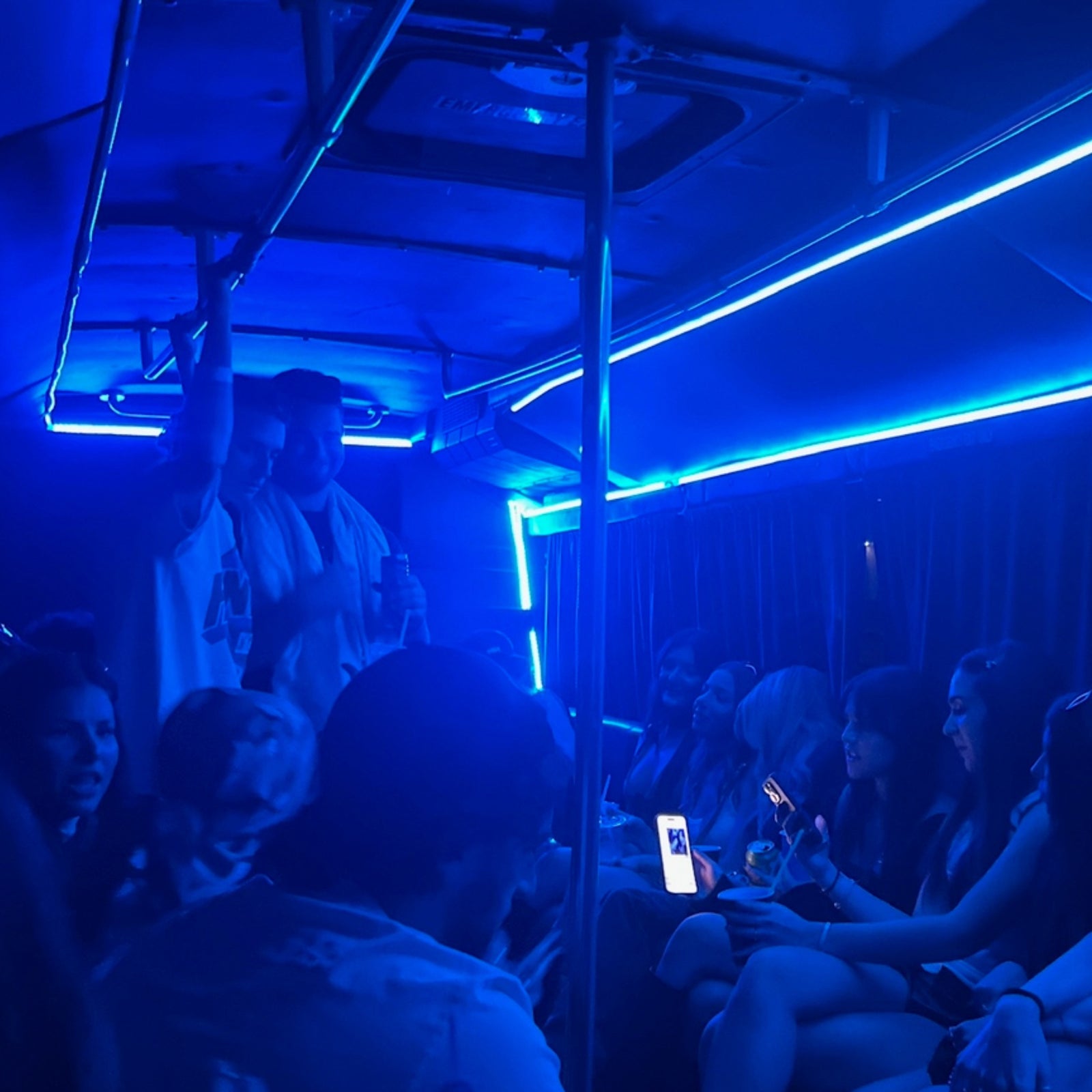 Party bus interior with dance pole and sound system